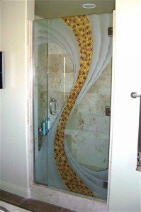 etched decorative glass shower enclosure wave formation shattered effect "Cyclone" shower door with narrow side panel. Center section is 3-dimensionally carved and painted, side waves are carved and shaded.
