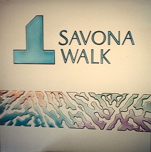 Custom Glass Sign that is sculpture carved and painted. The background is solid frost sandblasted.