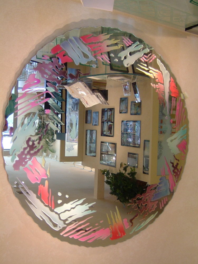 Art Deco Mirror, hand carved and painted frame design in brilliant magentas, reds, blues and greens.