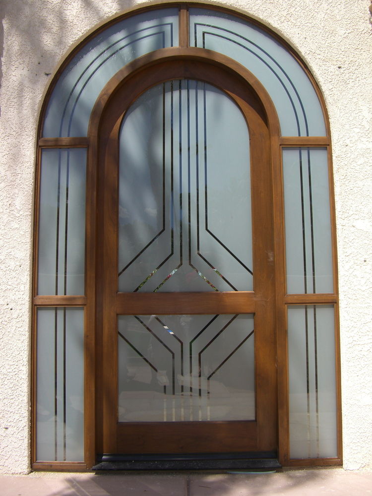 Sleek pinstripes are featured in this Glass Entry of etched glass with clear pinstriping