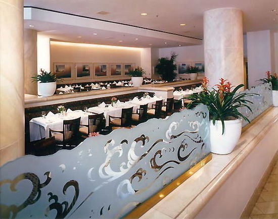 etched glass panels oceanic wave curls Etched Glass Panels, restaurant dividers that have been solid (reverse) etched, with an irregular chiseled top edge. This glass is installed inside the Long Beach Renaissance Hotel, in Long Beach, California.