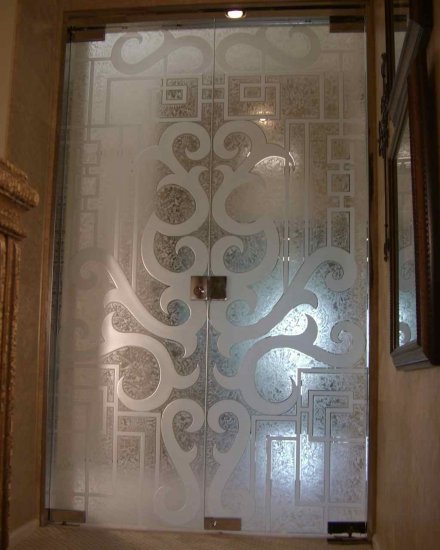 frameless all glass doors Frosted glass doors with carved glass design.