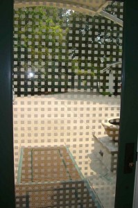 etched carved glass squares pattern door Close up, from inside the house.